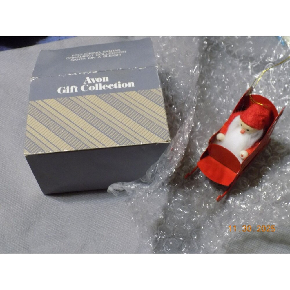 Avon Frolicking Santa ornament Christmas in box